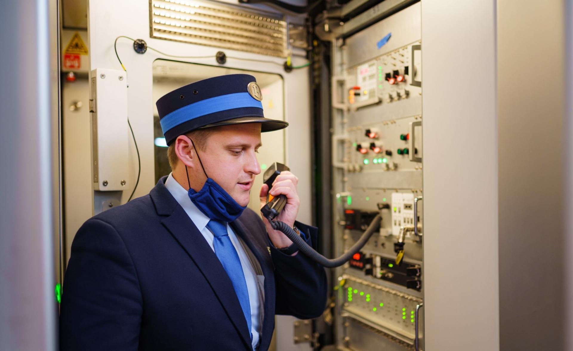 Employee using passenger communication unit from audio communication system